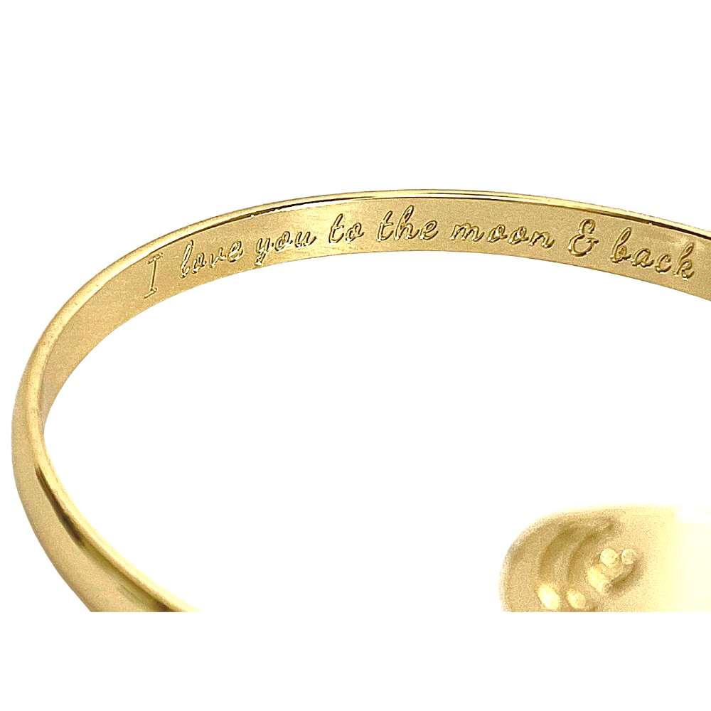 Gold engraved bracelet band with moon-heart motif and message text detail