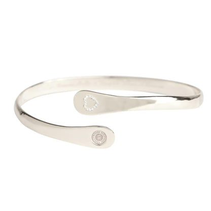 Silver hinged bracelet with heart charm inset and round logo medallion