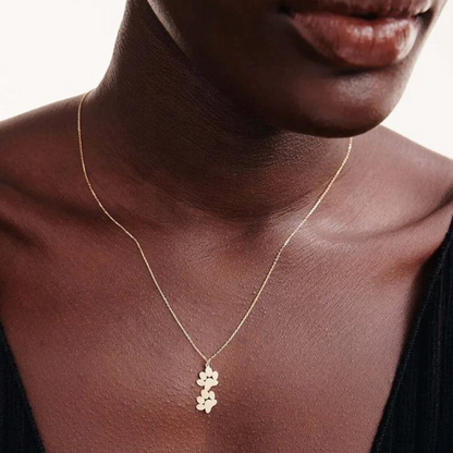 Gold-tone double paw print pendant necklace with layered chain