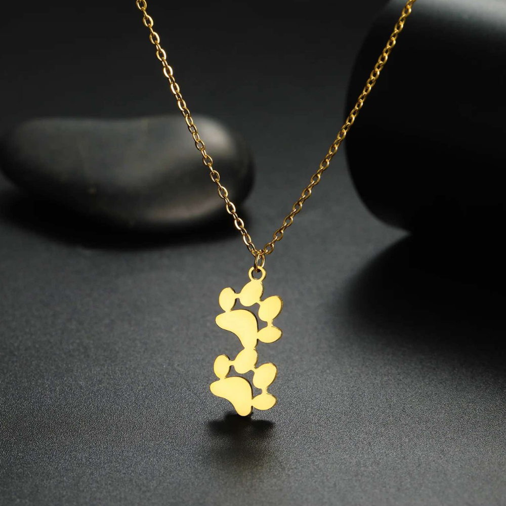 Gold-tone double paw print pendant necklace with twin paw charm design