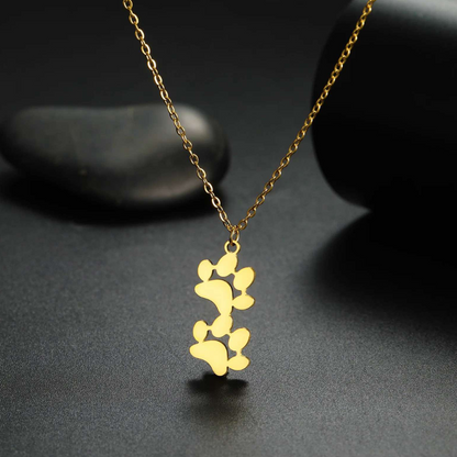Gold-tone double paw print pendant necklace with twin paw charm design