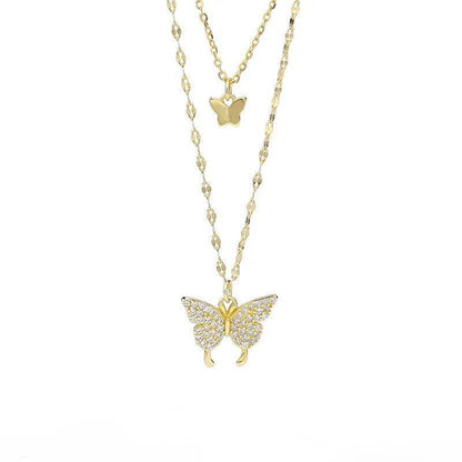 Two-layer butterfly necklace set with gold-tone chains and dangling butterfly pendants