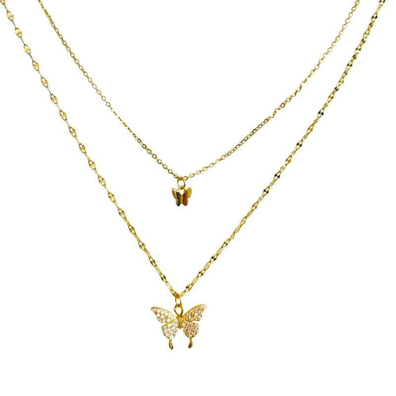 Two-layer butterfly necklace with gold-tone chains and small butterfly charms
