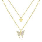 Two-layer gold butterfly necklace with small central charm and larger bottom butterfly pendant