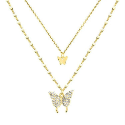 Two-layer gold butterfly necklace with small central charm and larger bottom butterfly pendant