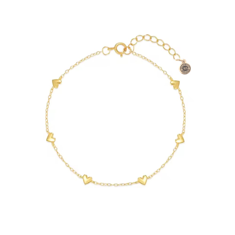 Gold heart charm bracelet with small heart links and secure clasp