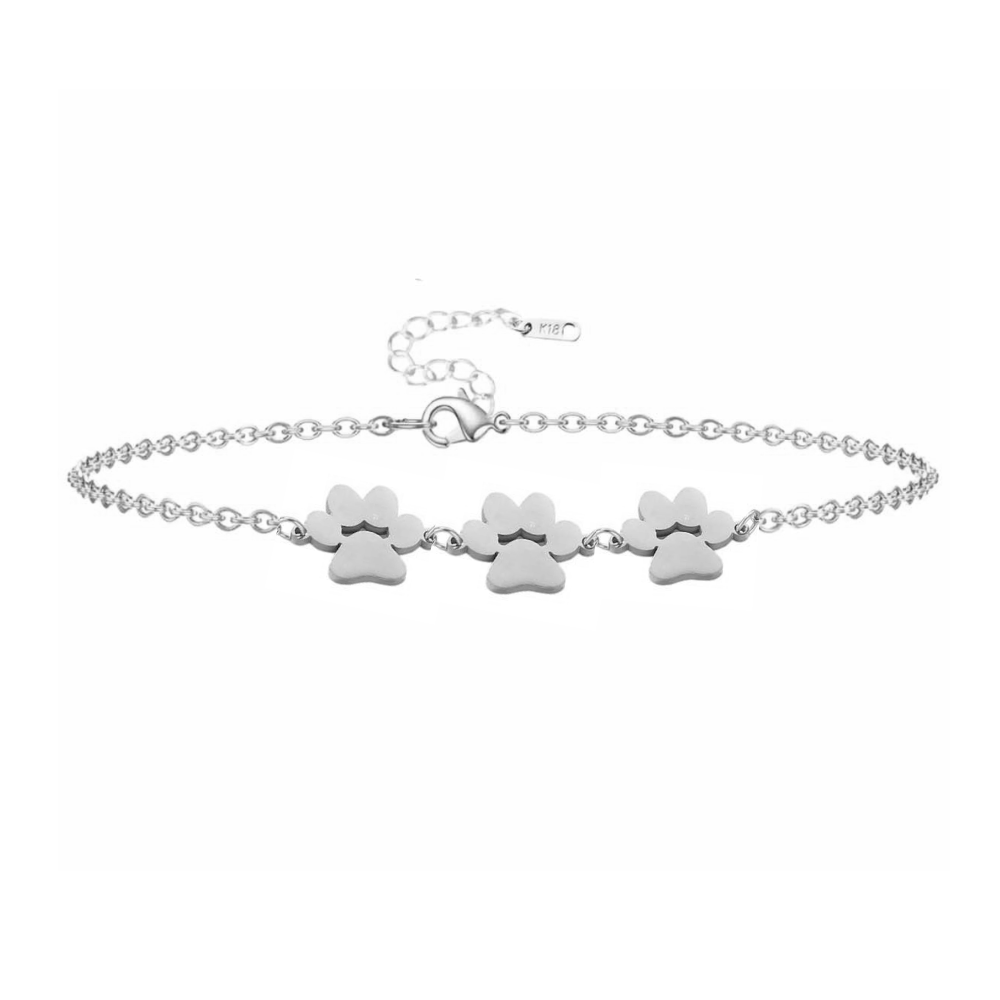 Silver paw print charm bracelet with three dangling paw charms