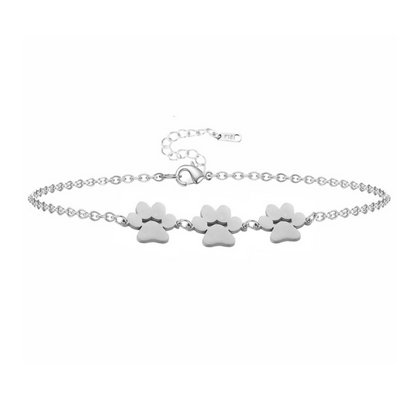 Silver paw print charm bracelet with three dangling paw charms
