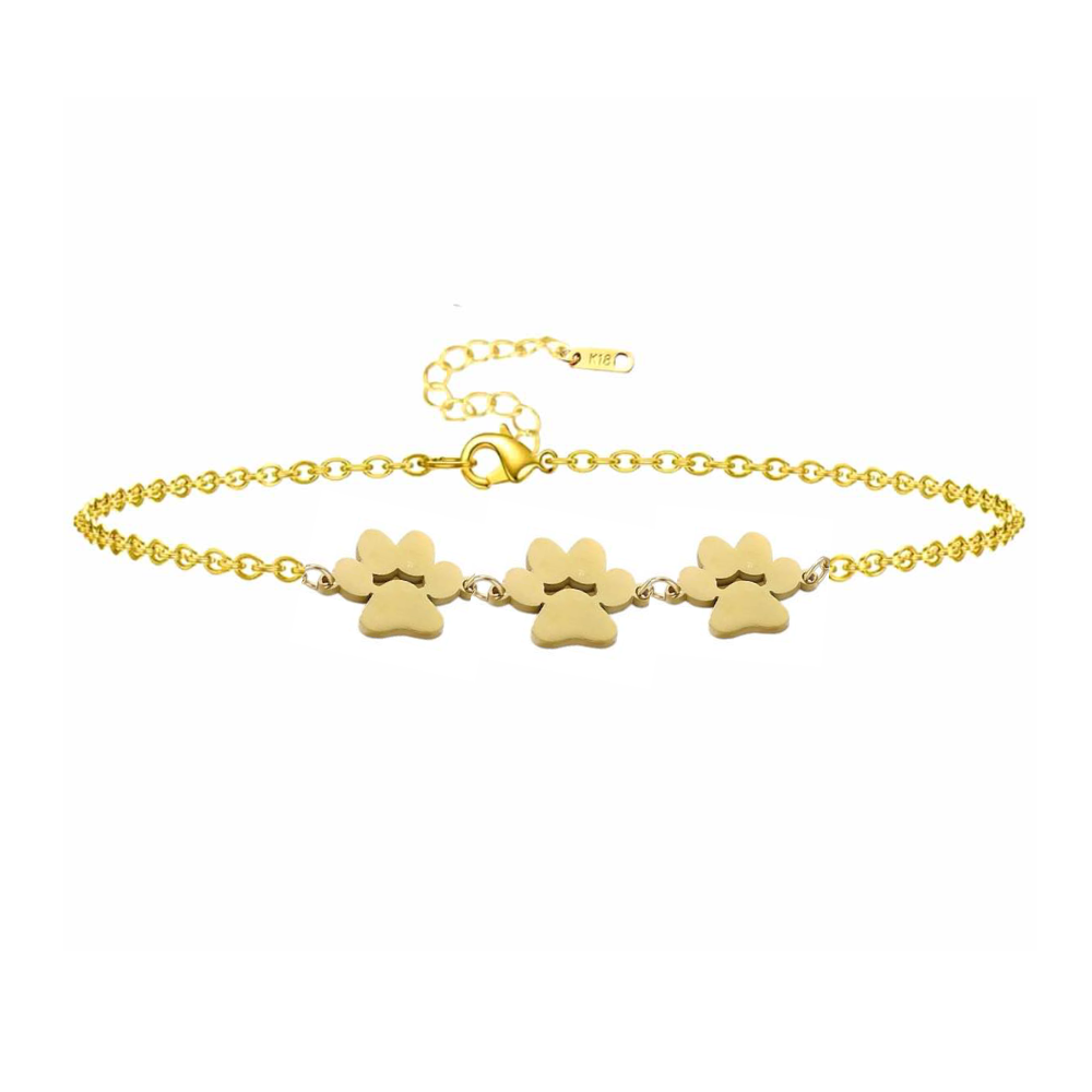 Gold paw print charm bracelet with three dangling paw charms