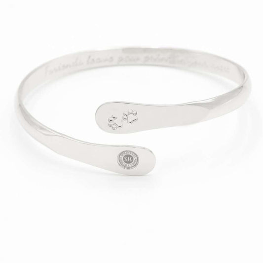 Silver paw print engraved cuff bracelet with small oval logo medallion