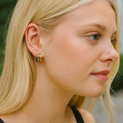 Mixed metal hoop earring, gold curved shape with silver inner edge