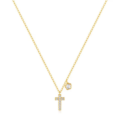 Gold-tone chain necklace with CZ cross pendant and CZ floral charm