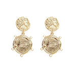 Gold coin dangle earrings with circular embossed coins and small dangling rings
