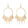 Gold hoop chandelier earrings with peach puka seashells and dangling charms