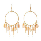 Gold hoop chandelier earrings with peach puka seashells and dangling charms