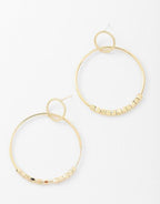 Gold hoop dangle earrings set with thin hoops and bead-link chain across bottom