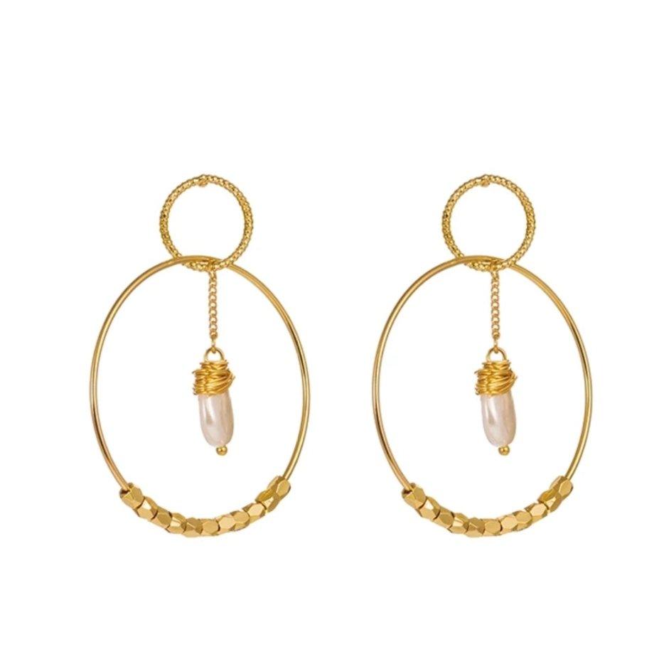 Gold double hoop earrings with small pearl drop charms and textured hoop details.