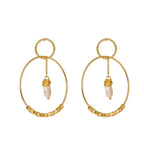 Gold double hoop earrings with small pearl drop charms and textured hoop details.