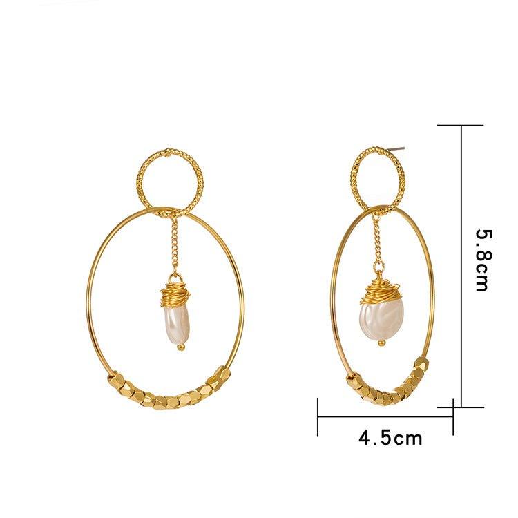 Gold double hoop earrings with pearl drop charms and braided texture on the hoops.