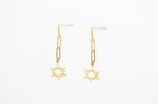 Gold-tone star dangle earrings with hook backs and sunburst pendants