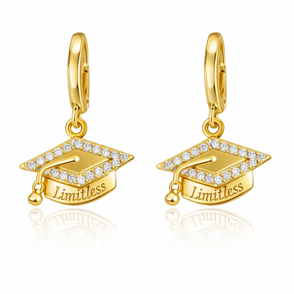 Gold huggie hoop earrings with graduation cap dangle charm, “Limitless”