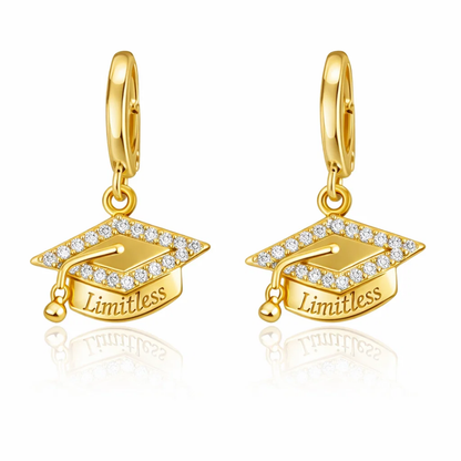Gold huggie hoop earrings with graduation cap dangle charm, “Limitless”