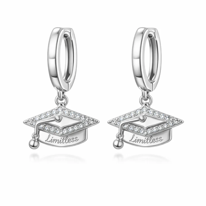 Silver huggie hoop earrings with graduation cap charm and small tassel, “Limitless”