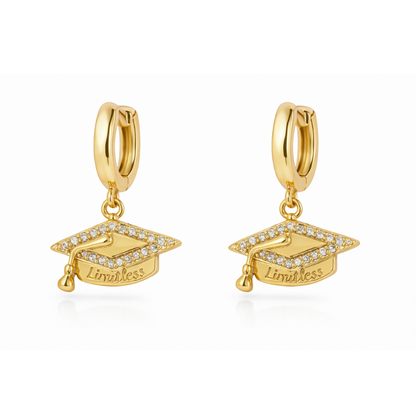 Gold huggie hoop earrings with graduation cap charm and “Limitless” text