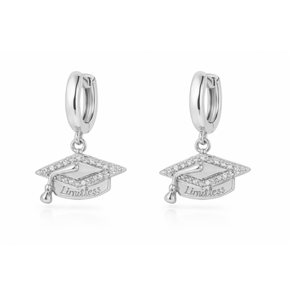 Silver huggie hoop earrings with graduation cap charm and “Limitless” engraving