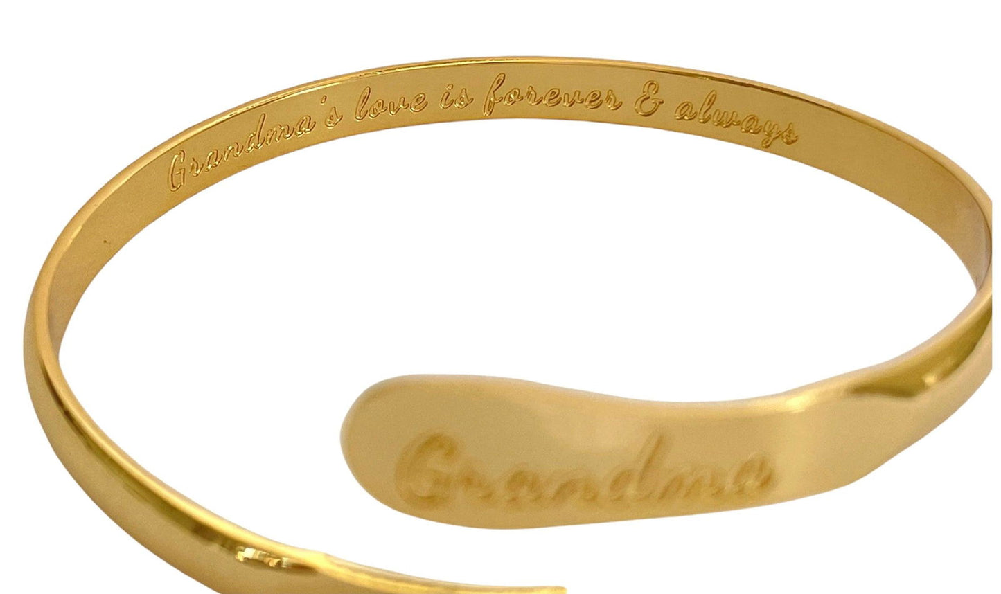 Gold-tone bangle bracelet with 'Grandma' engraving on the front panel