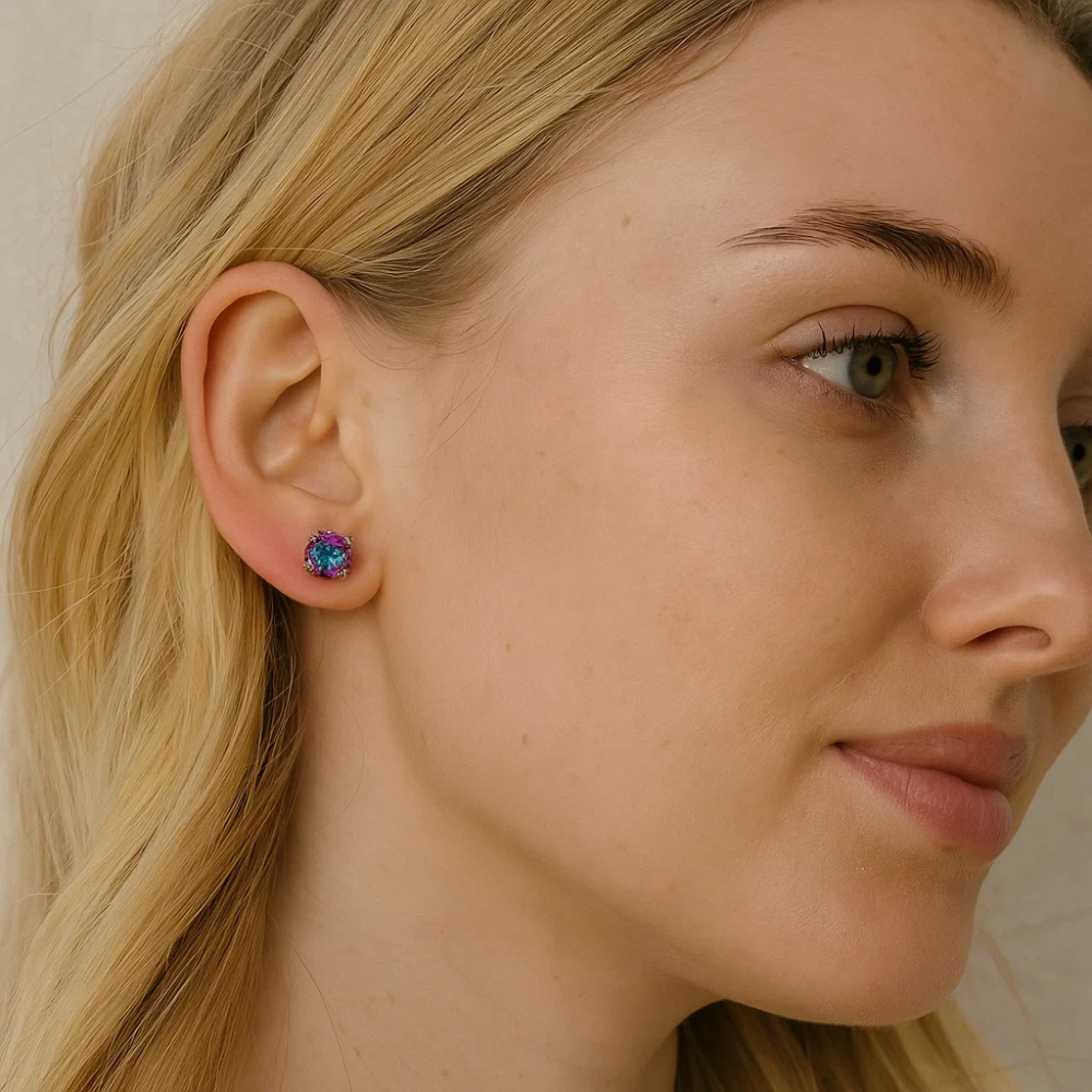 Round prong-set rainbow gemstone stud earrings on ear, silver-tone setting