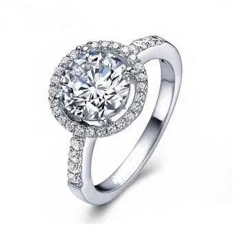 Silver-tone halo ring with round cubic zirconia center and pavé band