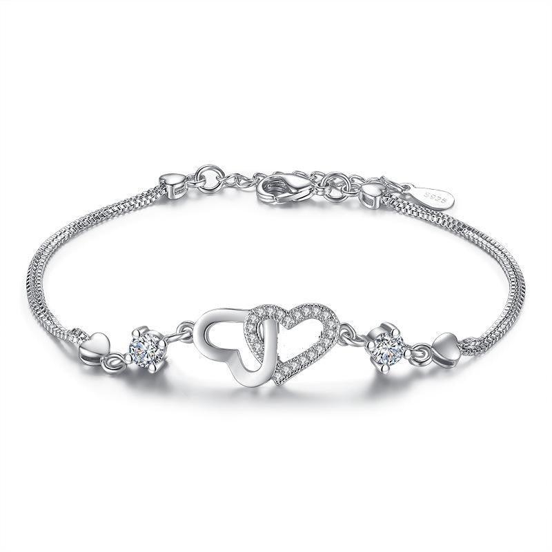 Silver-tone heart bracelet with cubic zirconia and toggle clasp
