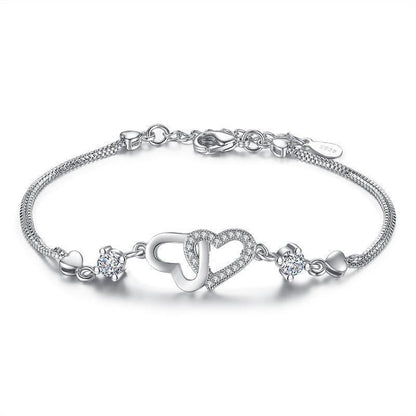Silver-tone heart bracelet with cubic zirconia and toggle clasp