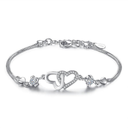 Silver-tone heart bracelet with cubic zirconia and toggle clasp