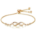 Gold infinity bracelet with adjustable chain and small crystal accents