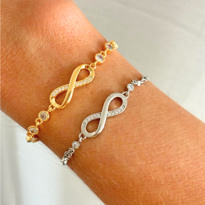 Infinity bracelets in gold and silver with crystal accents on wrist