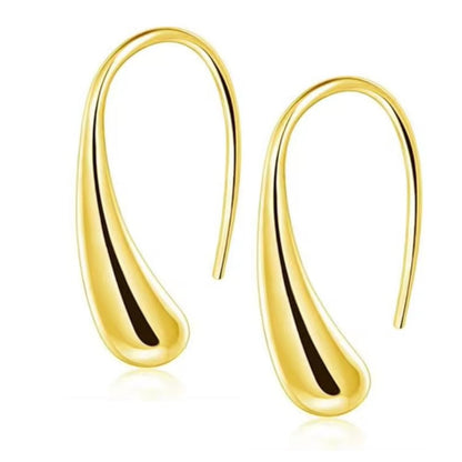 Gold teardrop dome drop earrings with curved hollow U design, shiny finish