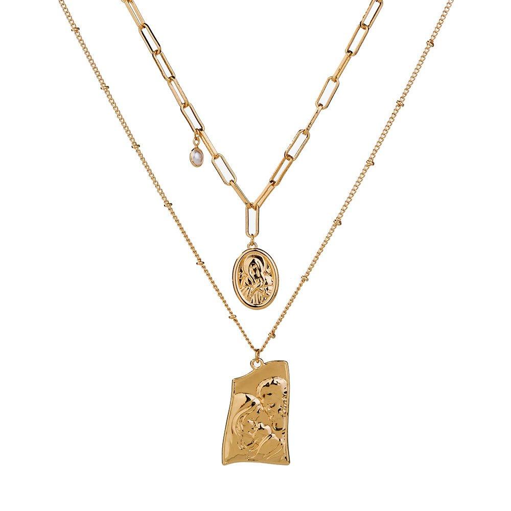 Gold layered necklace with Jesus pendant and round medallion, linked chain.