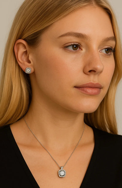 Silver-tone cubic zirconia halo pendant necklace with small cushion center stone, thin chain.