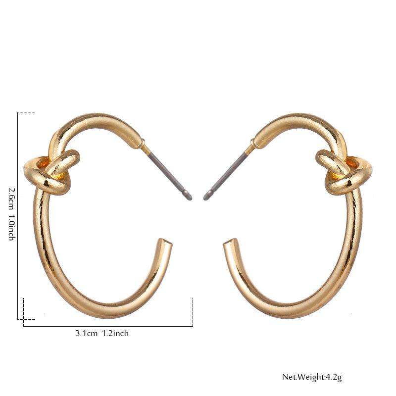 Gold knot hoop earrings with twisted knot detail on the front loop