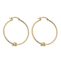 Gold knot hoop earrings with twisted knot detail at front