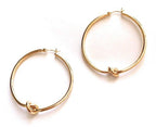 Pair of gold knot hoop earrings, circular hoops with twisted knot detail