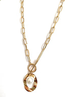 Gold link necklace with oval pendant, faux pearl, and dangling loop detail