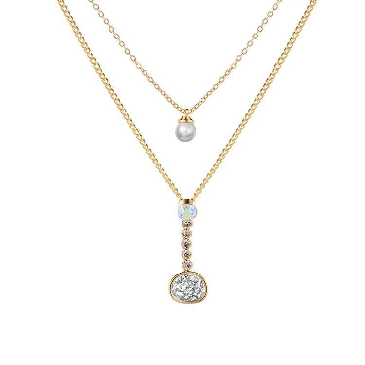 Layered gold-tone necklace with pearl, crystal, and round druzy-style pendant