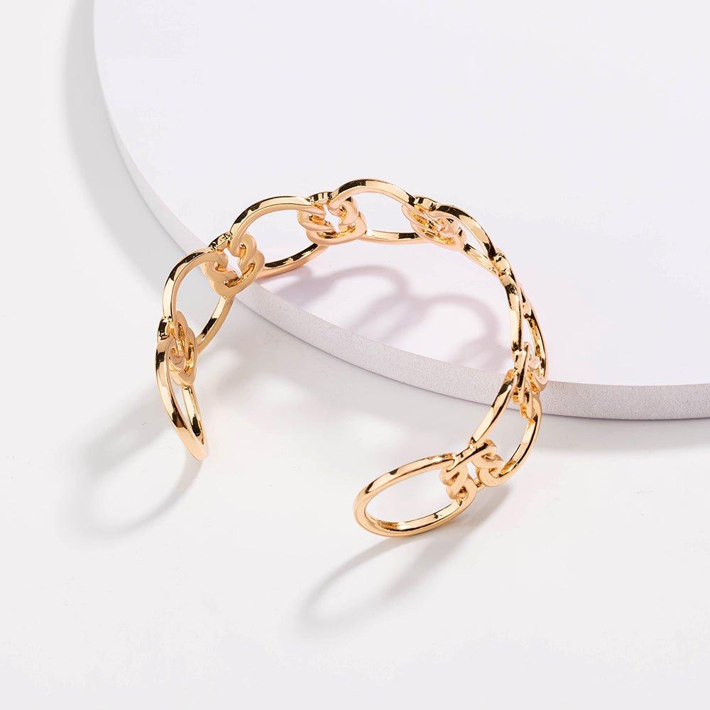 Gold love-knot link bracelet, close view of circular chain links and knot detail