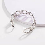 Silver love-knot link bracelet, close view of circular chain links and knot detail
