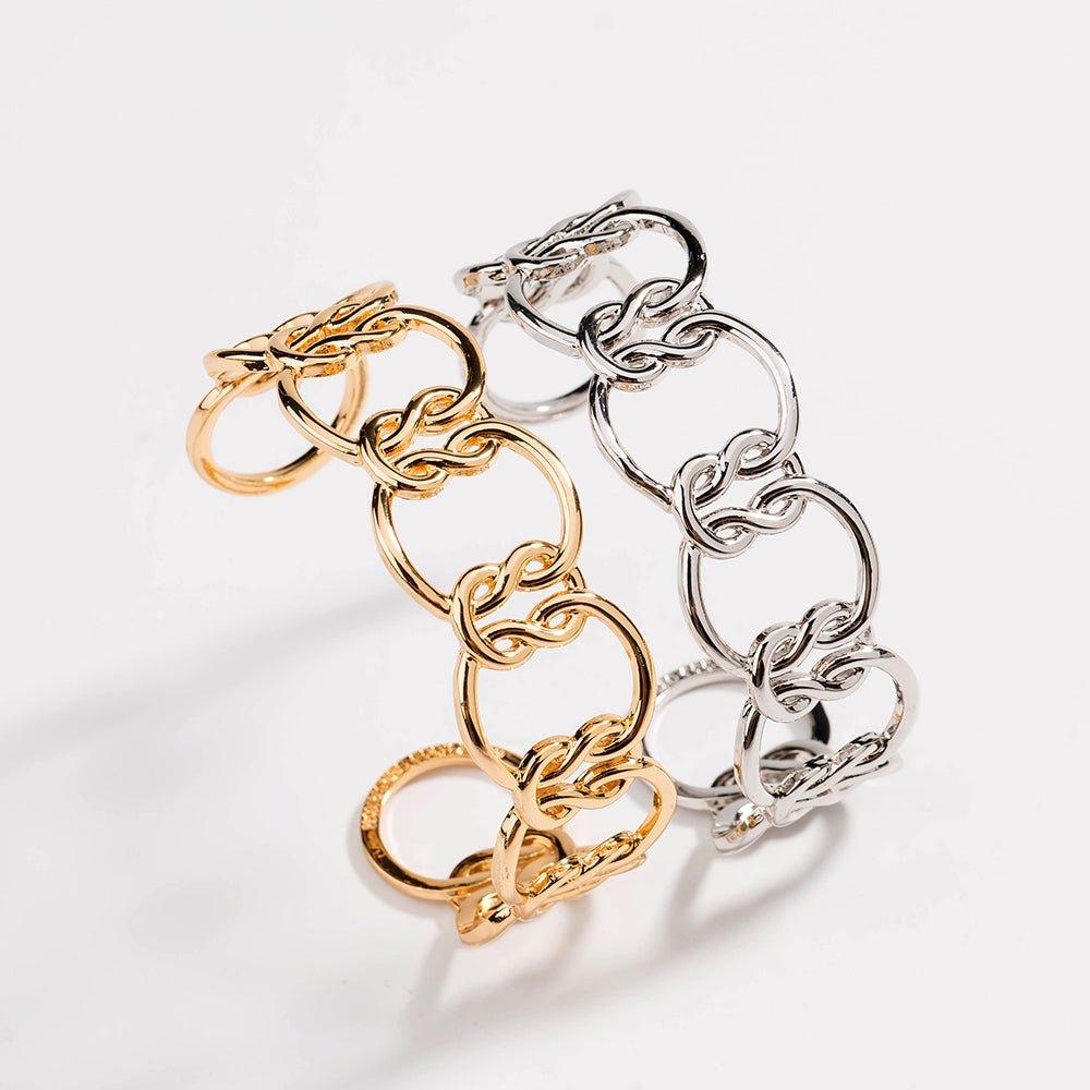 Two-tone love-knot link bracelet with gold and silver chain links interwoven