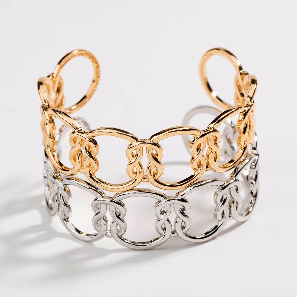 Two-tone love-knot link bracelet with gold top links and silver bottom links