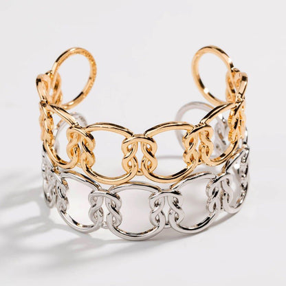 Two-tone love-knot link bracelet with gold top links and silver bottom links